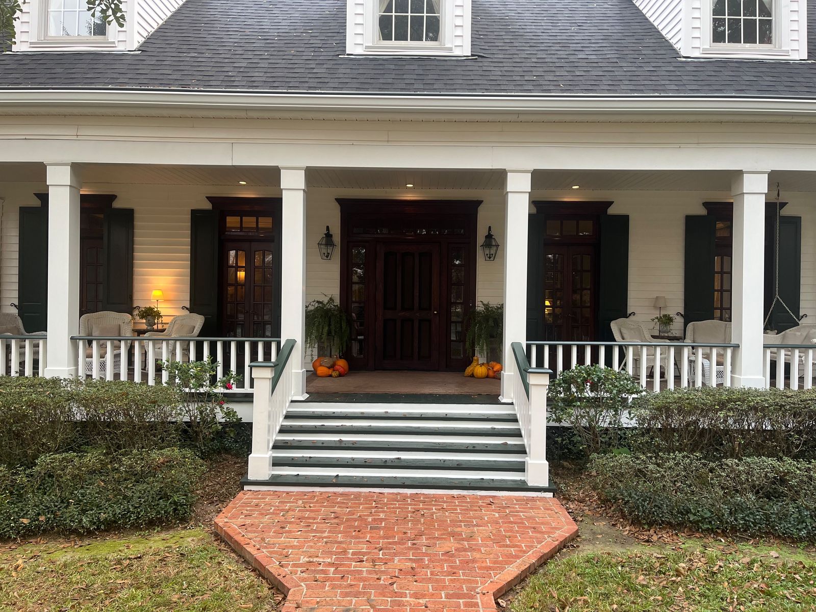 Classic front porch with brick walk and columns