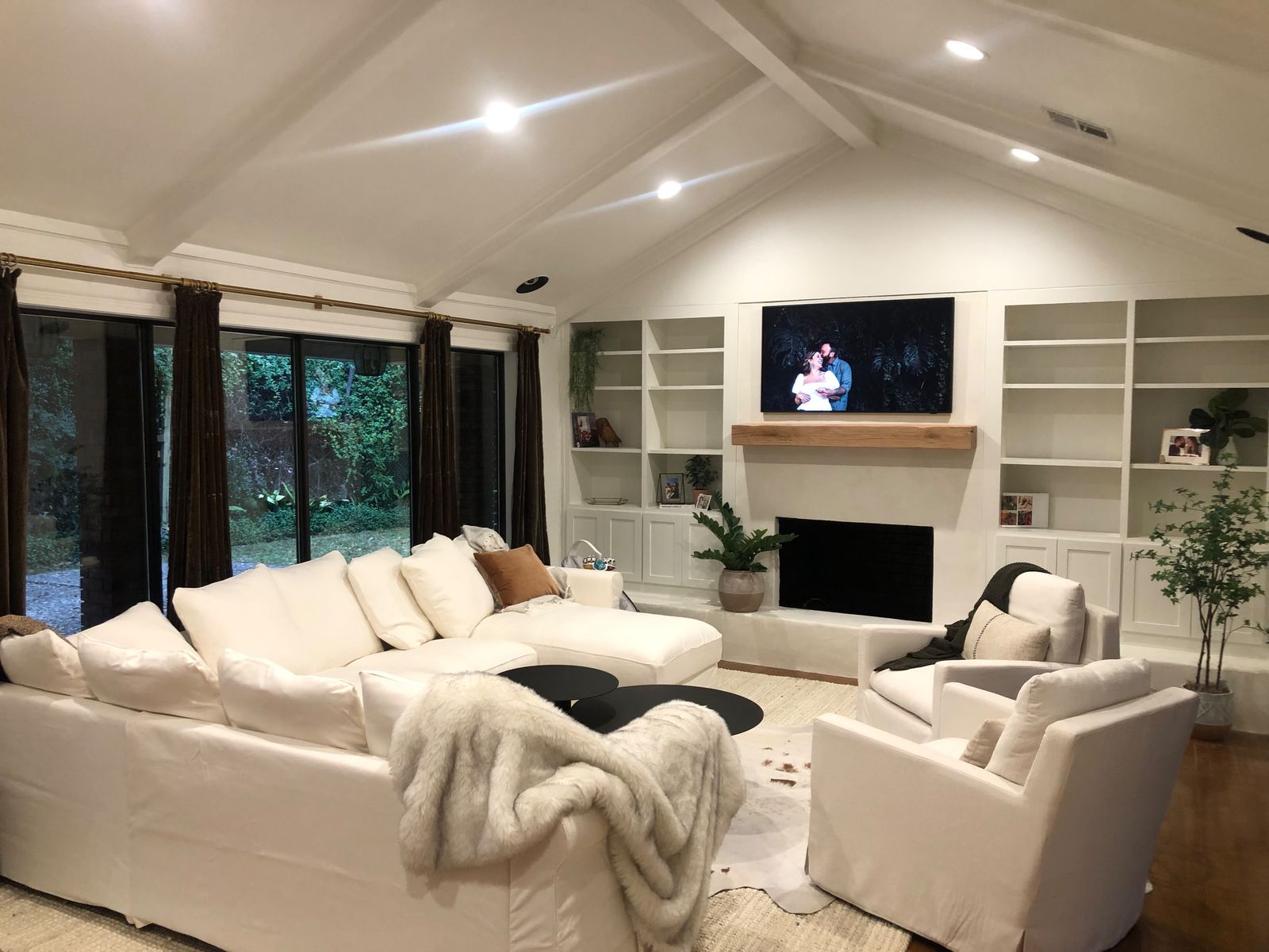 Vaulted living room with built-ins and fireplace