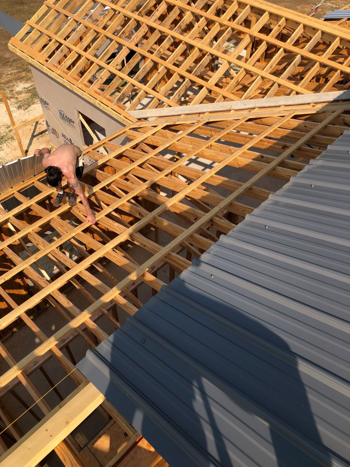 Purlins and metal roofing going on