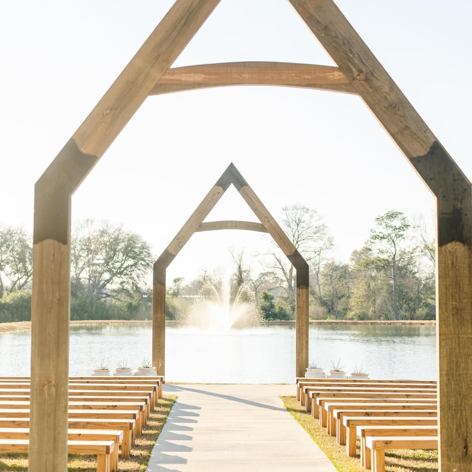 Timber A-frame arches by the lake