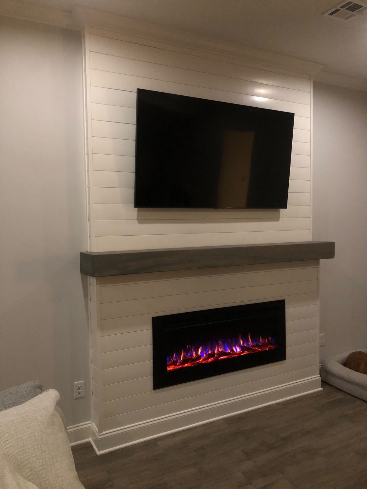 Shiplap fireplace wall with electric insert